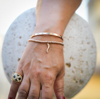 The Iconica Bangle bracelet in steel, with embedded Zircon and external engraving