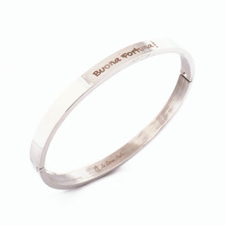 L'Iconica bangle bracelet in steel, "Buona Fortuna" engraving on the outside